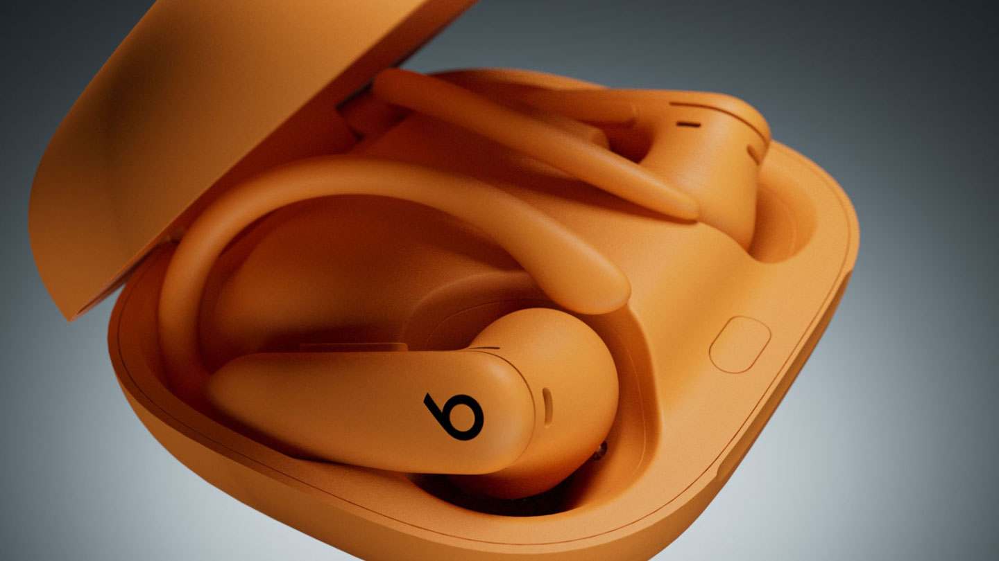 Close-up of Electric Orange Powerbeats Pro 2